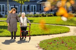 image of resident on walking path at sunnyside manor