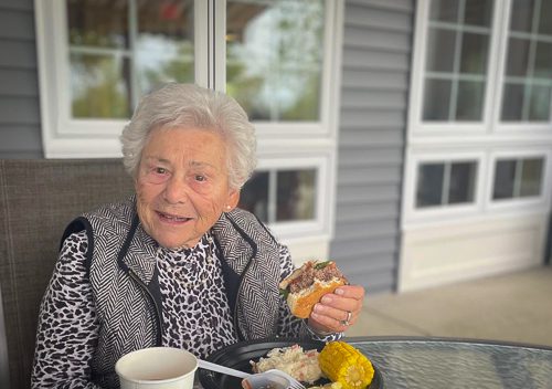 image of resident smiling at bbq