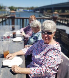 sunnyside manor residents enjoying lunch outside