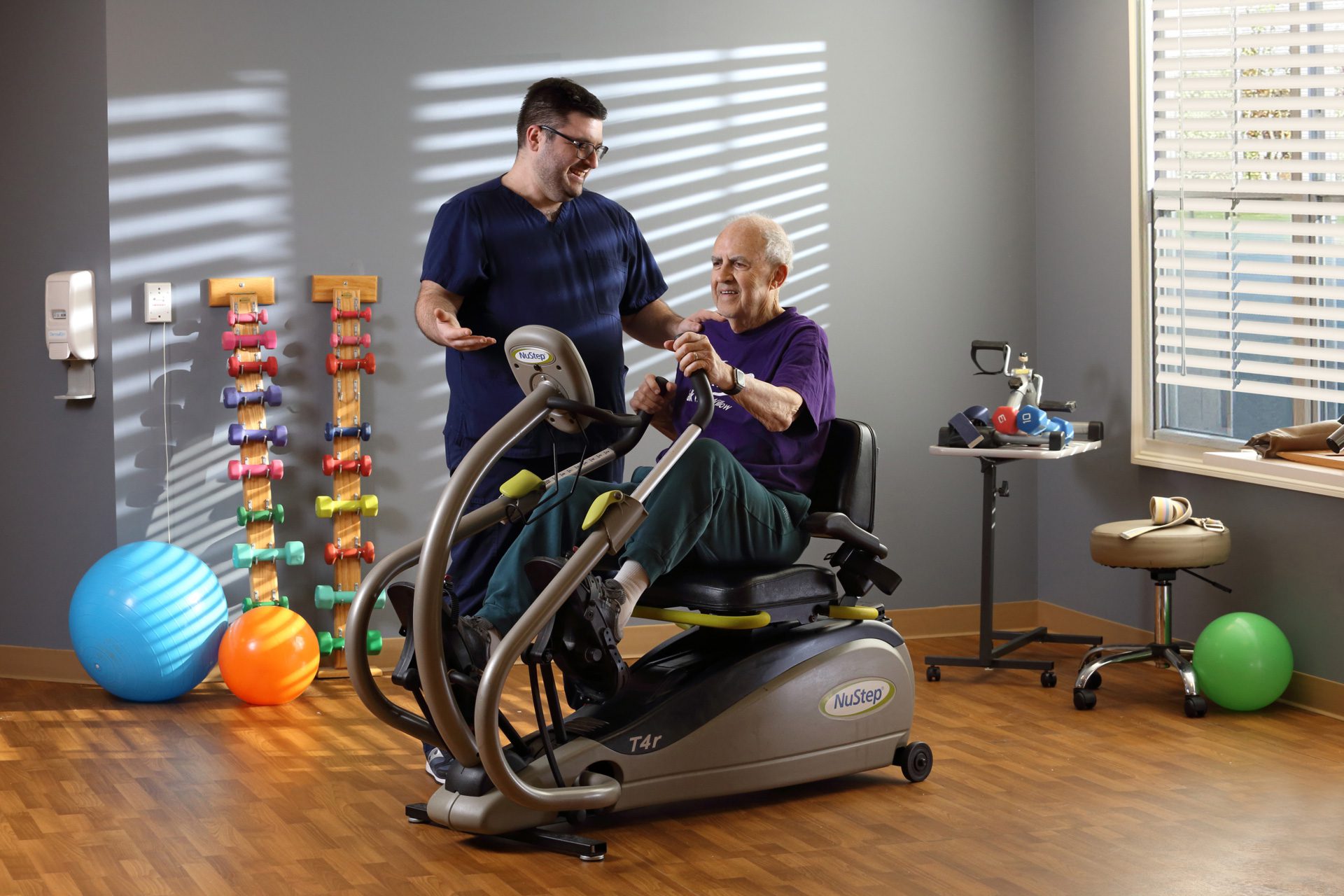 image of senior using rehabilitation equipment at sunnyside manor